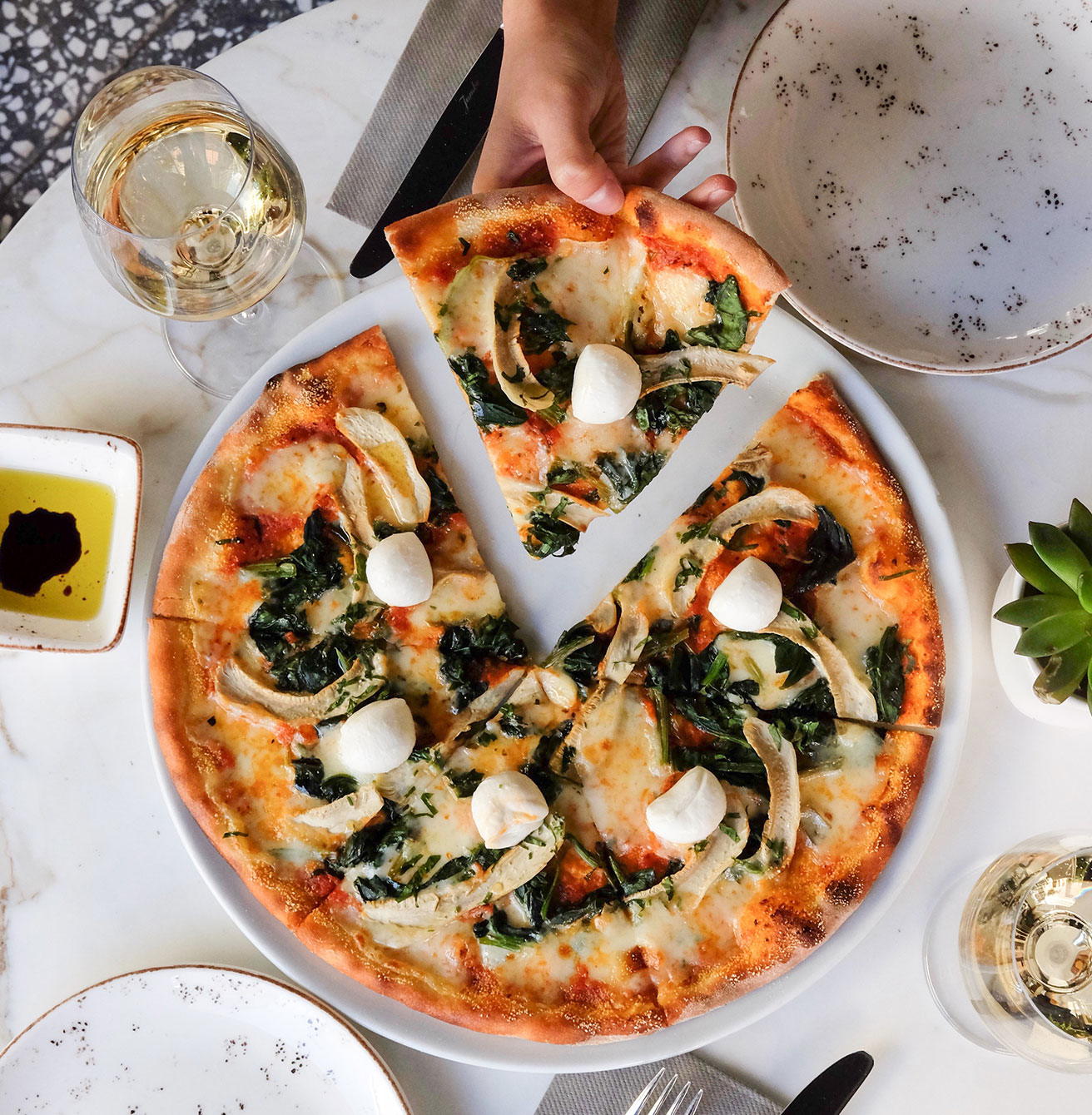 Thin crust spinach and mozzarella pizza